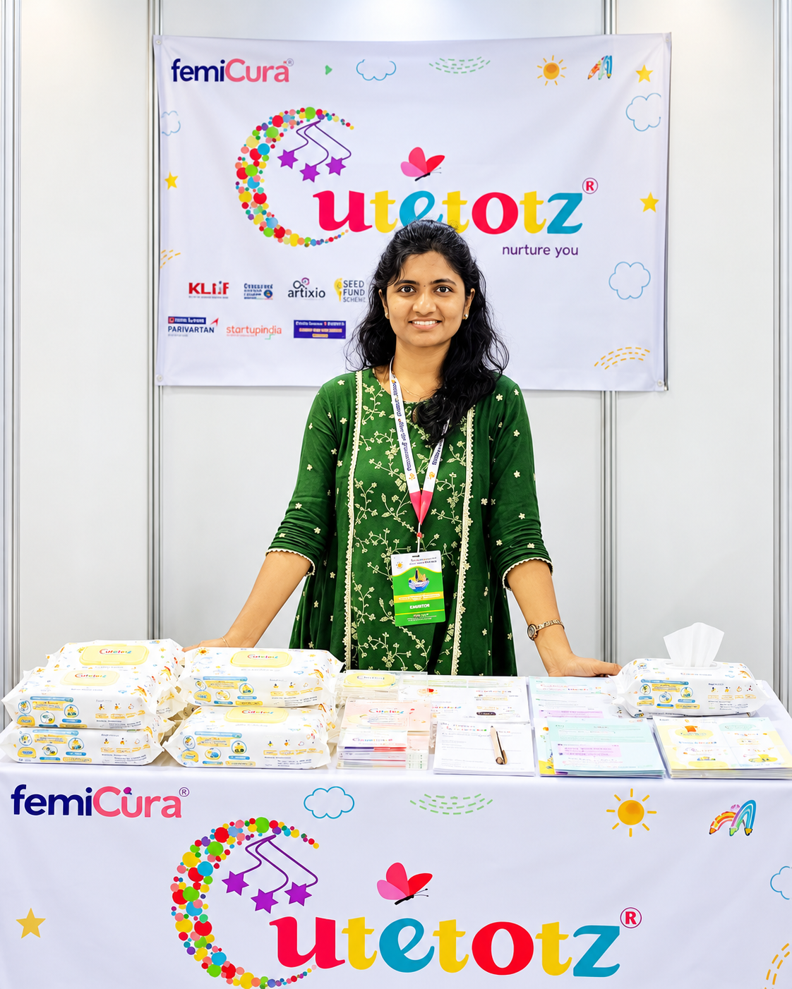 AI-edited portrait of Meena U at a CutetotZ exhibition stall with product displays